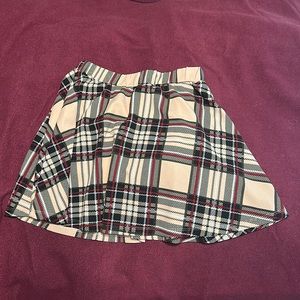 Small flannel skirt in tan, black, red and white